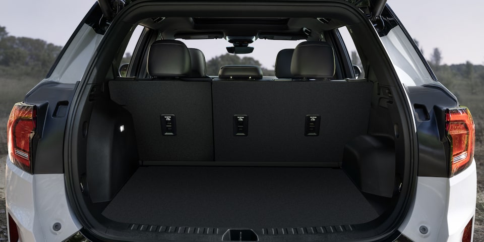 Back view of the spacious trunk area of the 2025 GMC Acadia AT4.