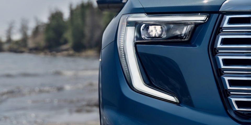 Front view of the headlamp of the 2025 GMC Acadia Denali.