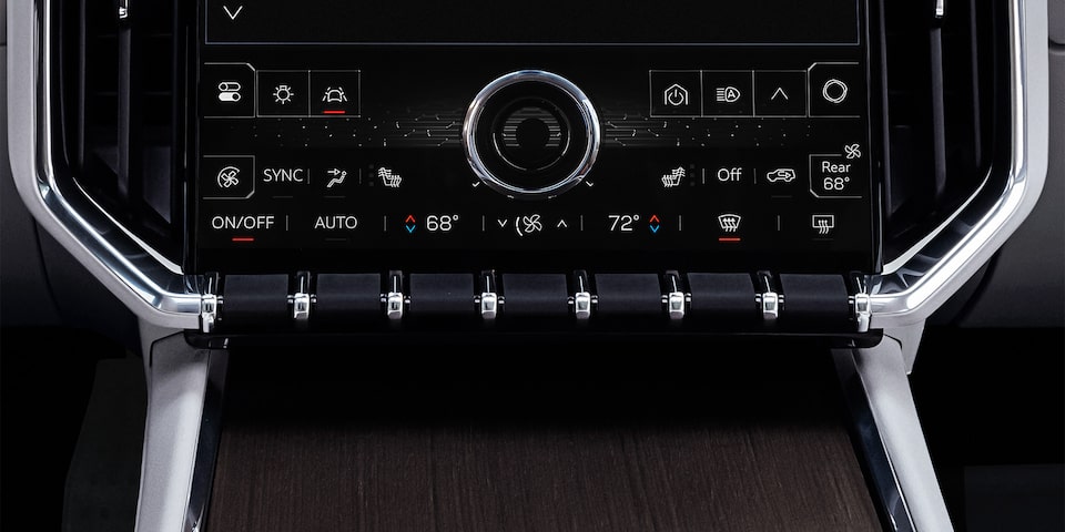Close up view of the buttons inside the 2025 GMC Acadia Denali.
