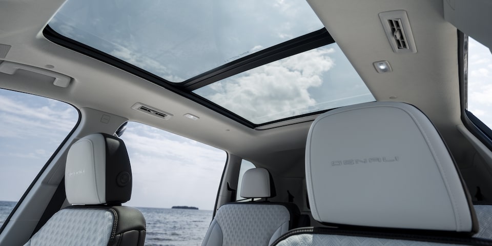 Interior view of the sunroof on the 2025 GMC Acadia Denali.