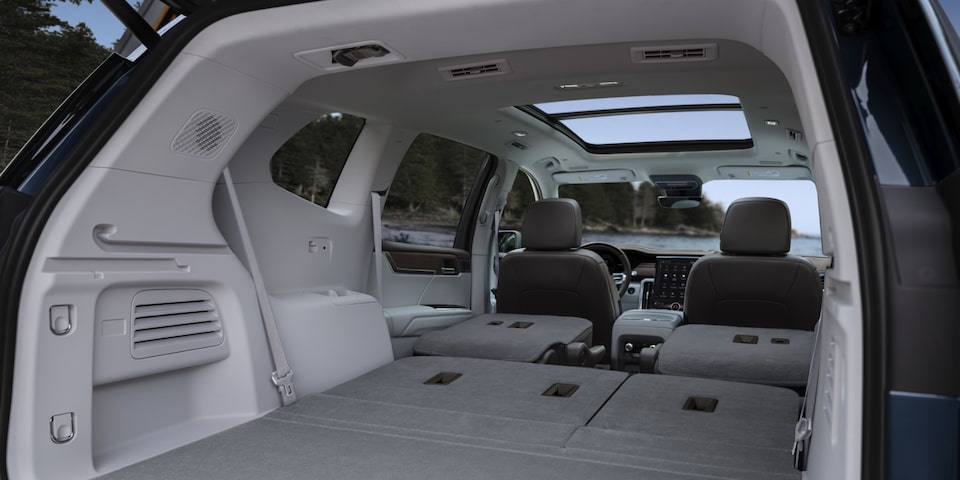 Back view of the interiors of the 2025 GMC Acadia Denali with its back rows folded up.