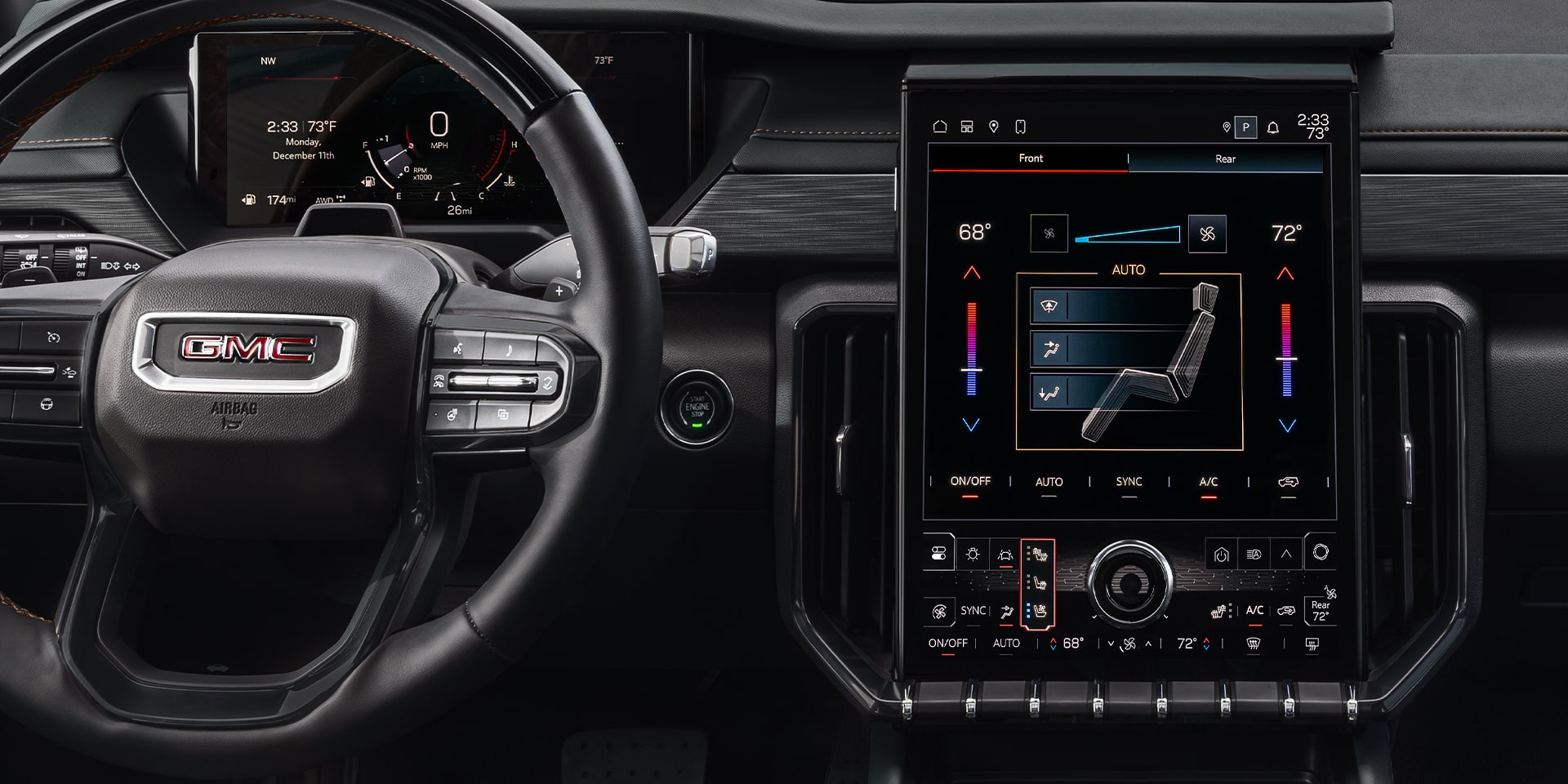 Vue rapprochée du système d’infodivertissement et du volant du VUS intermédiaire GMC Acadia 2026.