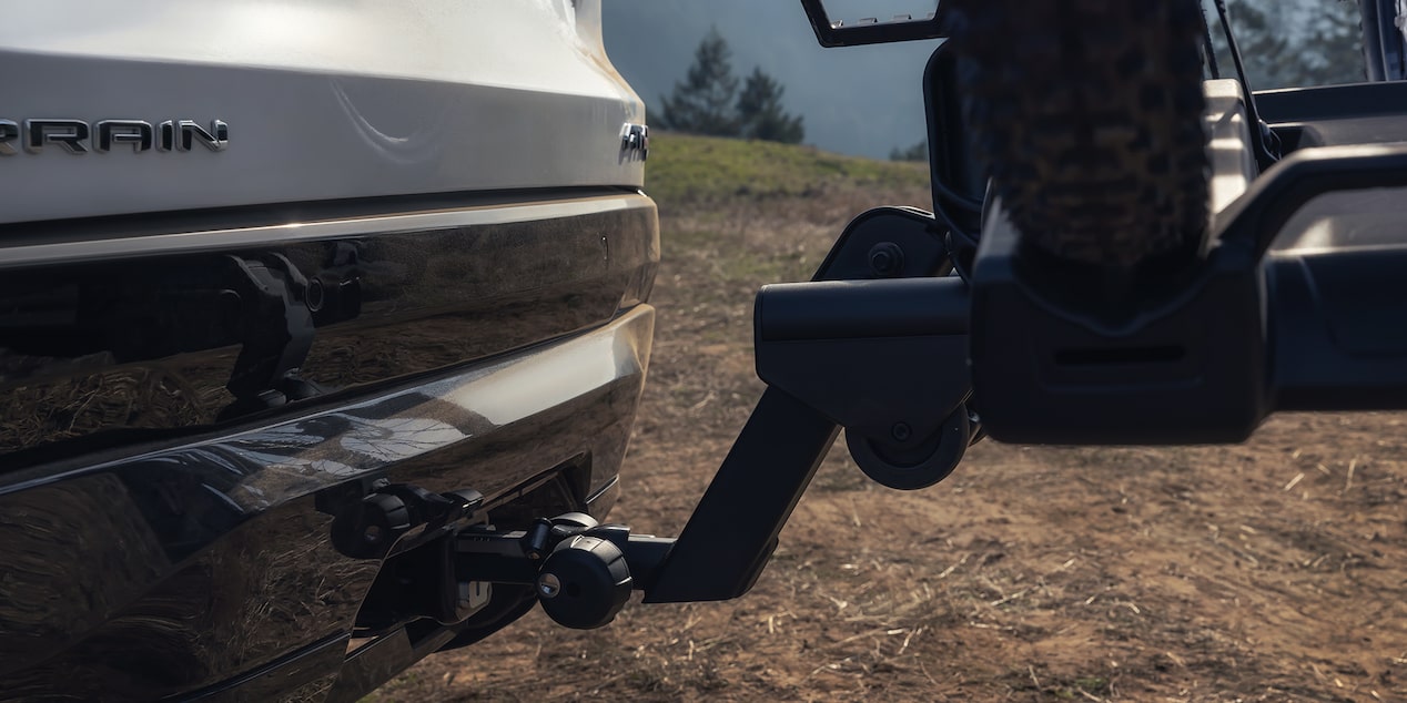 Close-up View of the Hitch on the 2026 GMC Terrain AT4 Small Off-Road SUV Driving Through the Forest.