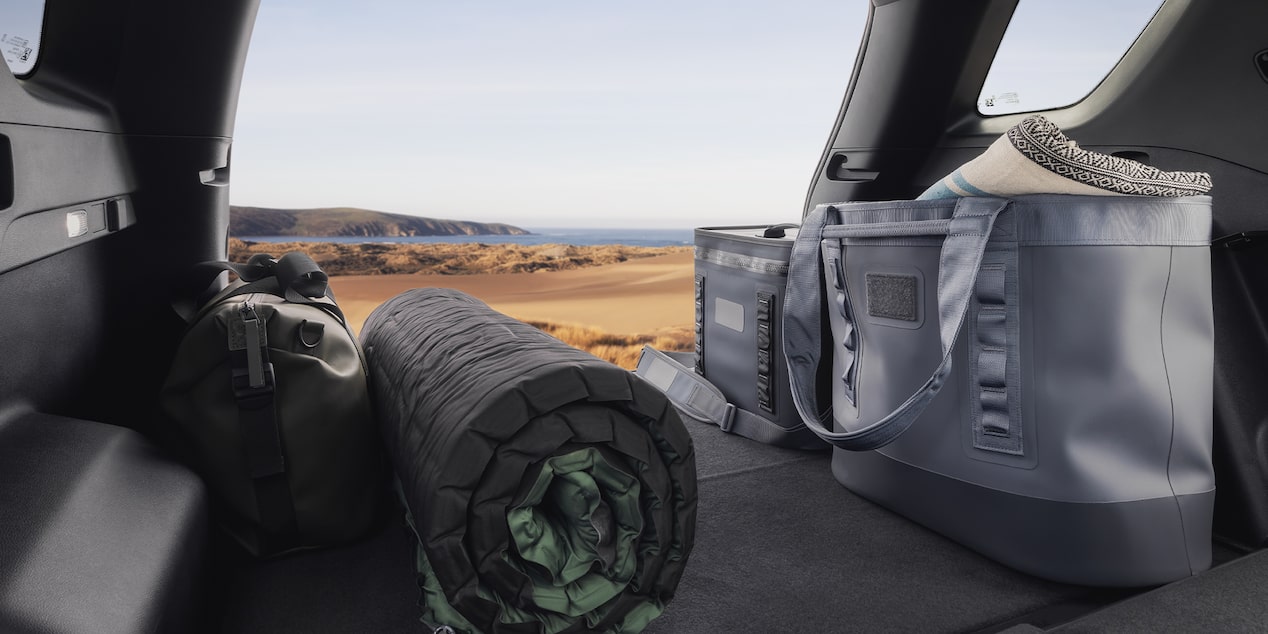 An Interior View Inside the 2026 GMC Terrain AT4 Looking Out the Open Tailgate.