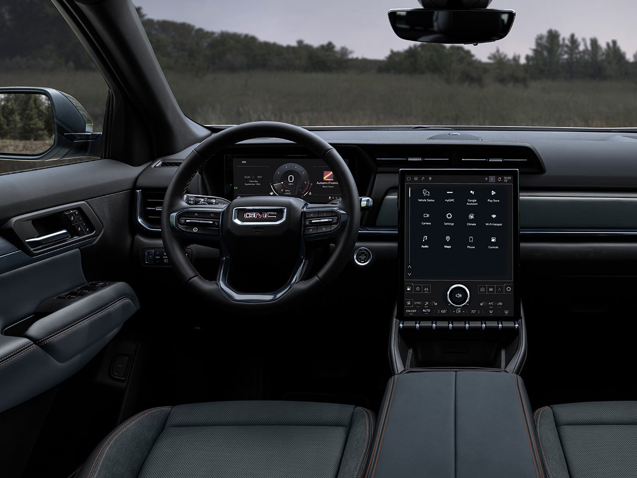 Interior View of the Dashboard, Steering Wheel, and Infotainment System in the 2026 GMC Terrain AT4 Small Off-Road SUV.