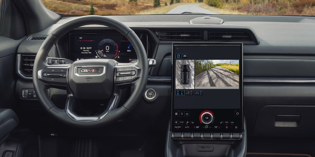 Interior View of the Dashboard, Steering Wheel, and Infotainment System in the 2026 GMC Terrain AT4 Small Off-Road SUV.