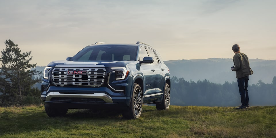 Front Three-Quarters View of a 2026 GMC Terrain Denali Parked at the Edge of a Cliff.