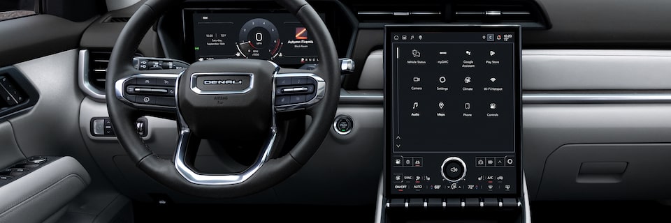 Interior View of the Steering Wheel and Infotainment System in the 2026 GMC Terrain Denali Luxury SUV.