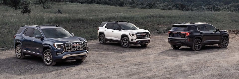Three 2026 Terrain vehicles parked near each other on a country road.