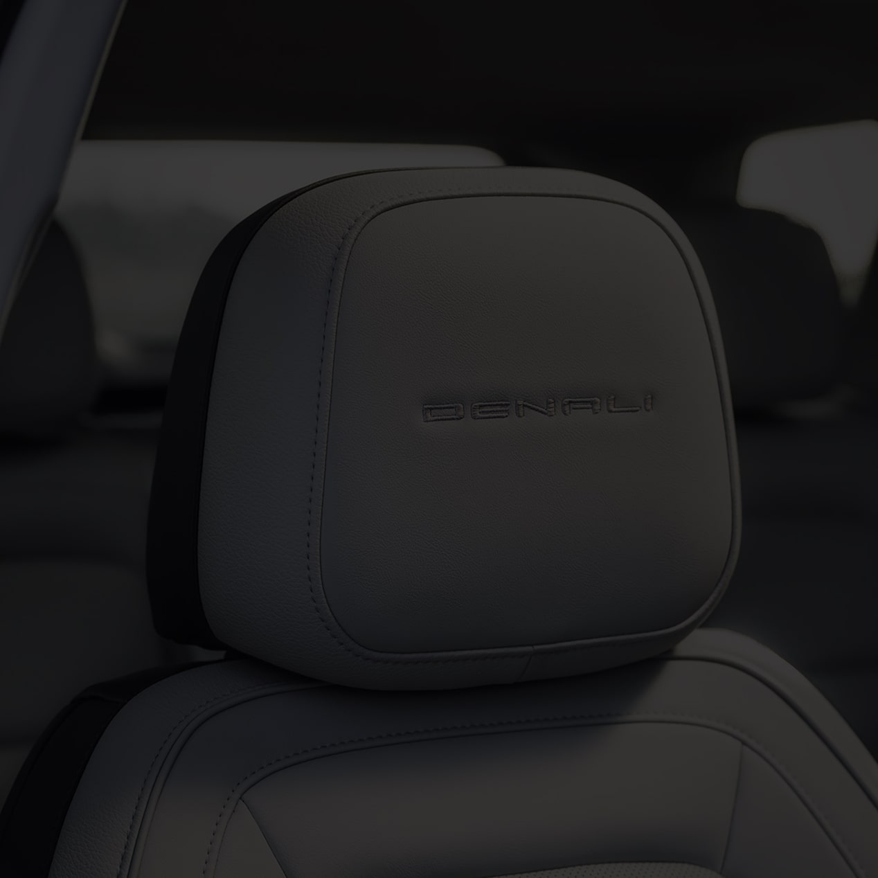 Close up view of the Denali badging etched on the seat headrests of the 2026 GMC Terrain Denali.