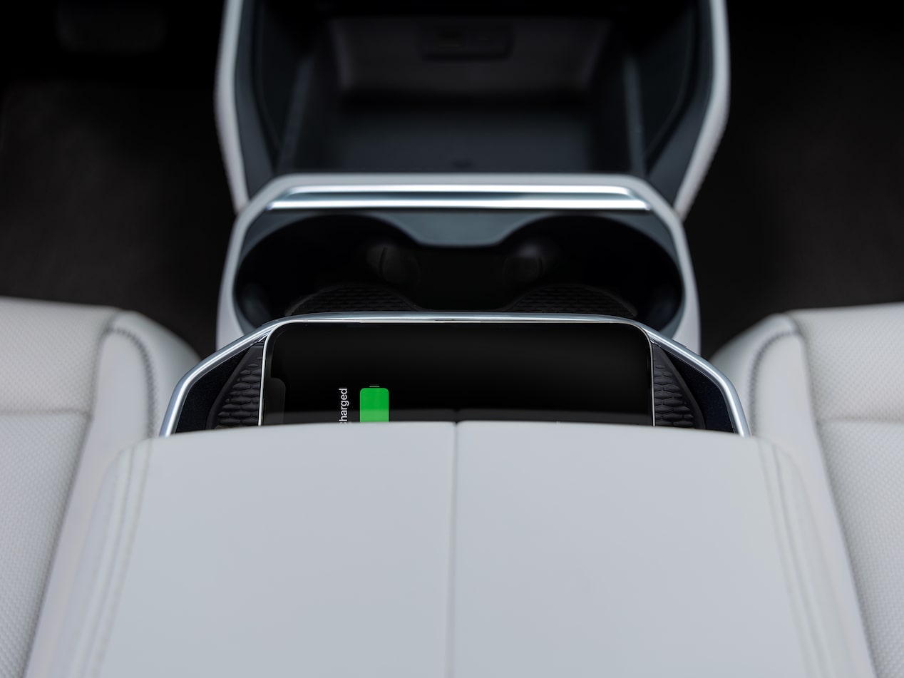 Close up view of a smartphone being charged wirelessly inside the 2026 GMC Terrain.