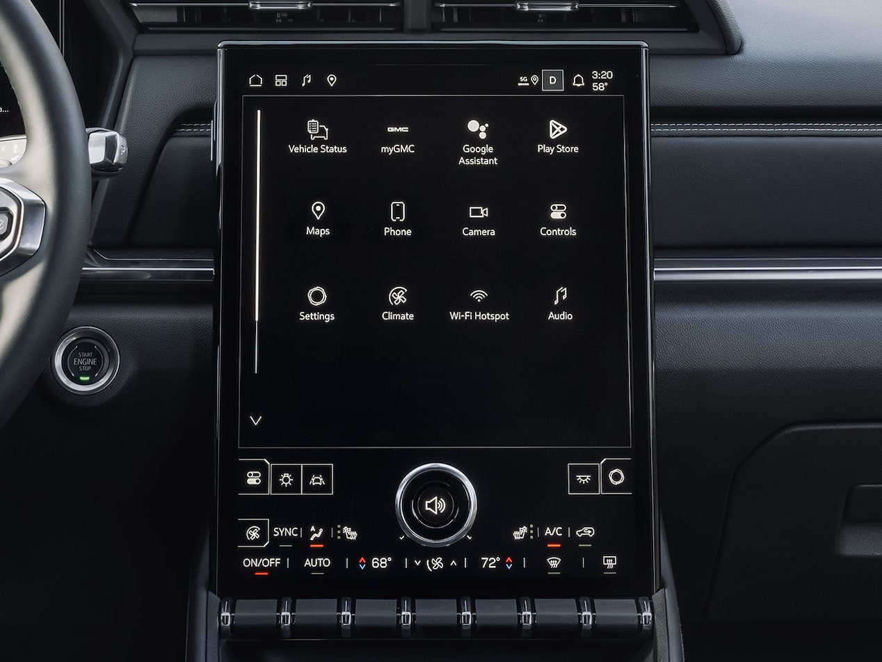 A person adjusting the volume of the 15" diagonal infotainment system on the 2026 GMC Terrain.