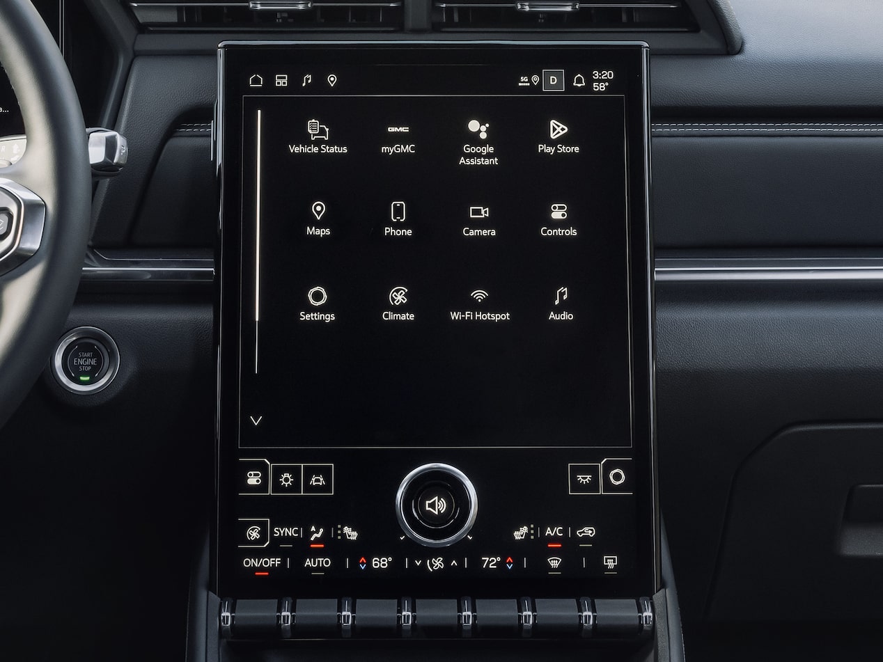 A person adjusting the volume of the 15" diagonal infotainment system on the 2026 GMC Terrain.