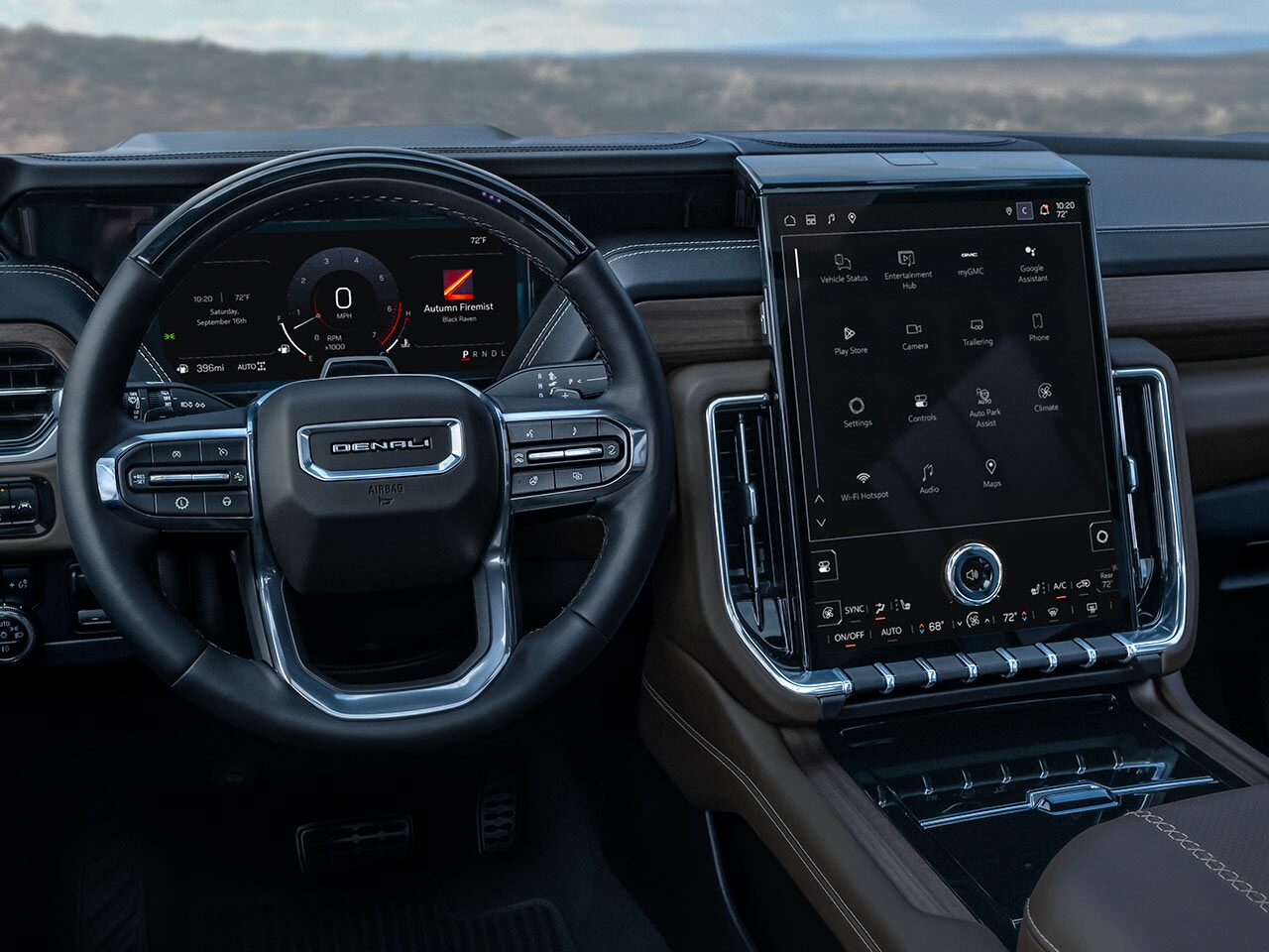 Le volant, le tableau de bord et le système d’infodivertissement du VUS de luxe à trois rangées GMC Yukon Denali 2026.