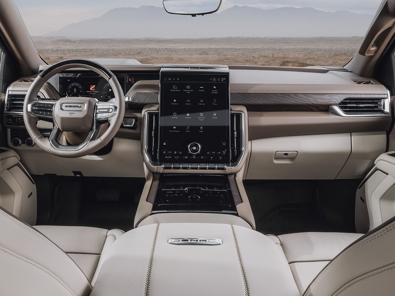 Les surfaces en cuir perforé avec surpiqûres uniques du VUS de luxe à trois rangées GMC Yukon Denali 2026.