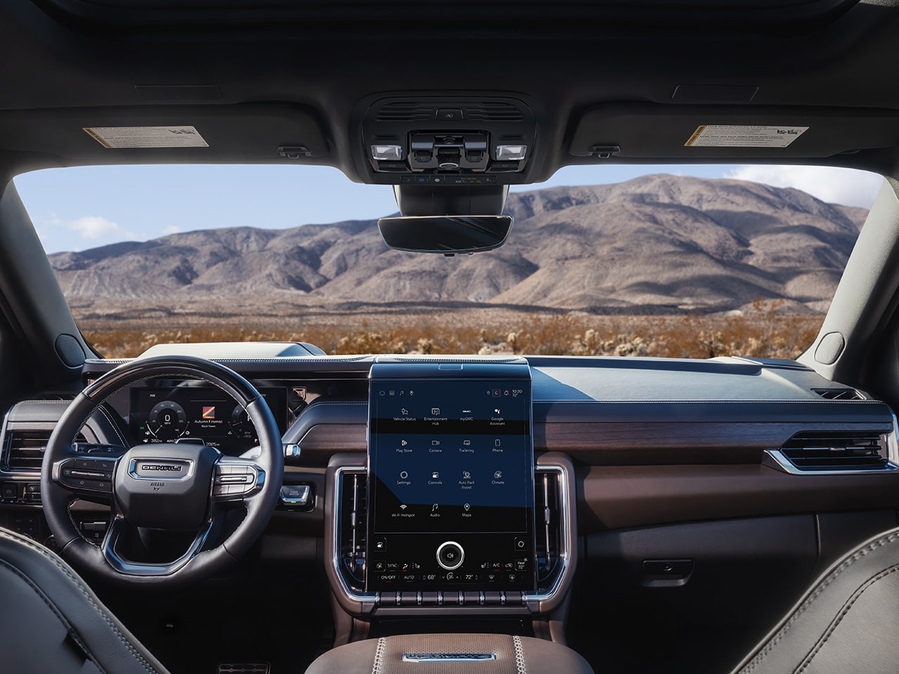 Le volant et le système d’infodivertissement du GMC Yukon Denali Ultimate 2026.