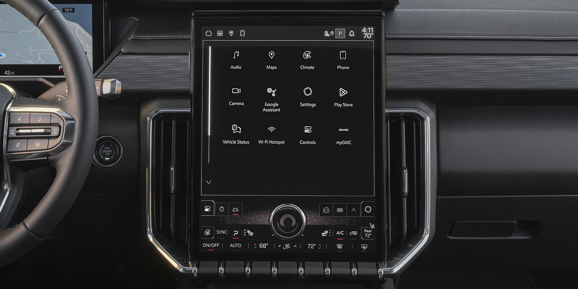 VIntérieurs de la GMC Acadia 2027 avec un grand écran tactile vertical affichant diverses icônes d’applications et contrôles de climatisation.