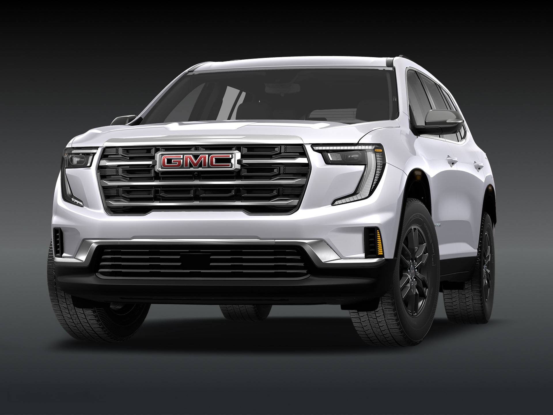 Vue de trois quarts avant du SUV GMC Acadia Elevation 2027, de couleur « blanc irisé », sur fond sombre.