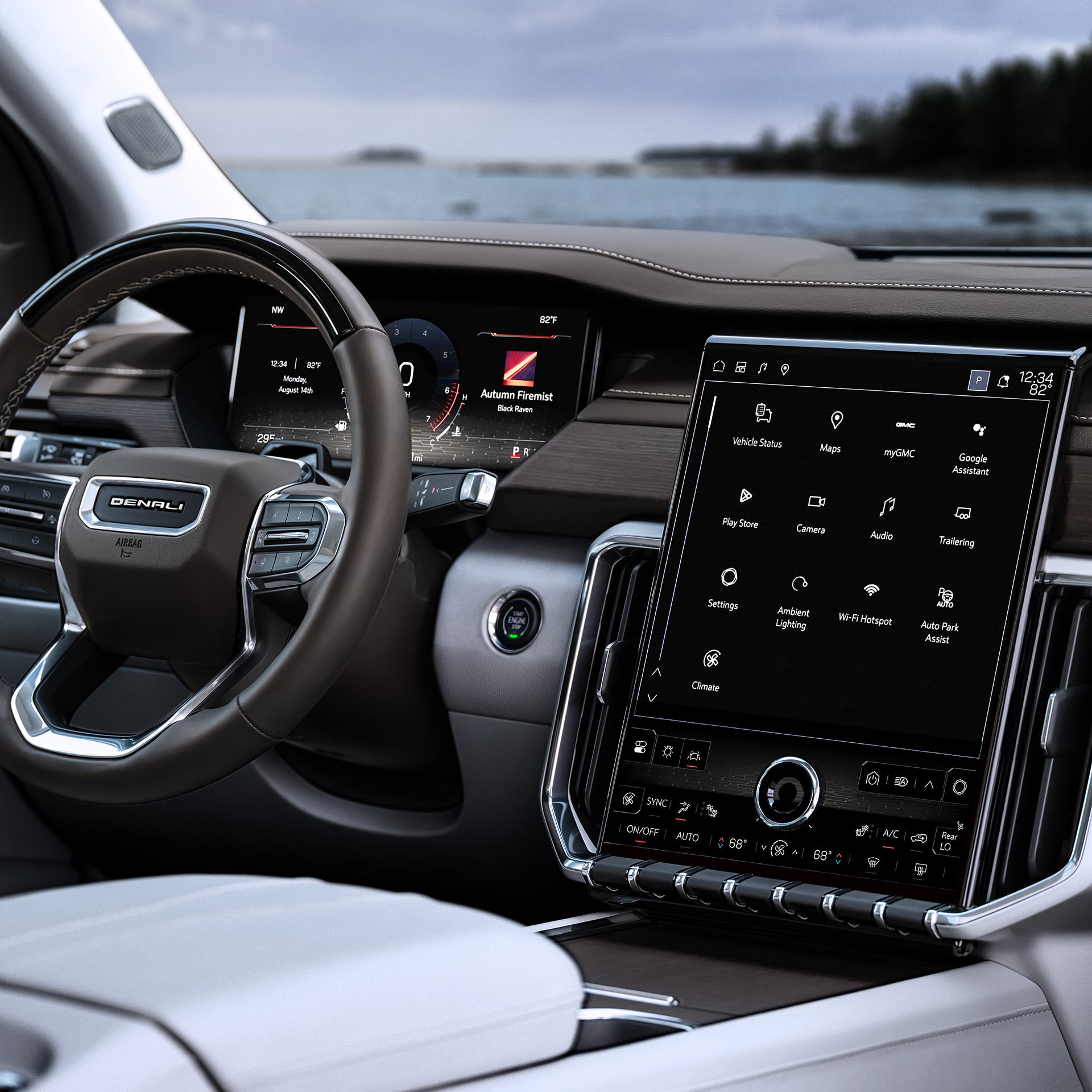 Le cockpit intérieur d’une GMC Acadia Denali 2027 comprend un volant, un tableau de bord numérique et un grand écran d’infodivertissement.