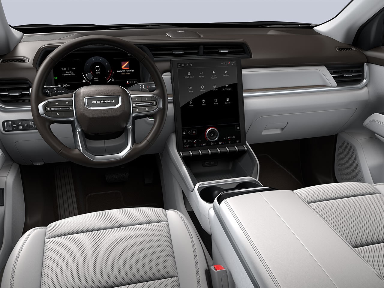The Driver's Side Interior of a 2027 GMC Terrain Denali with Light Ash and Brown Leather Seats, Steering Wheel, and Infotainment System.