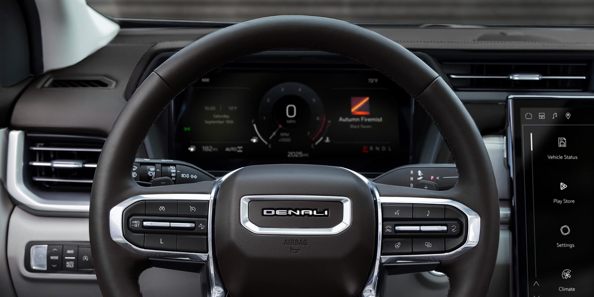 The Driver's View of the 2027 GMC Terrain Denali Steering Wheel and Digital Instrument Cluster Displaying Vehicle Information.