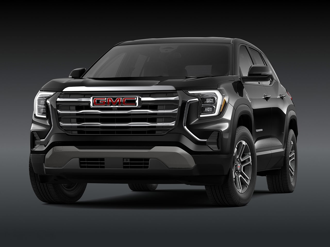 Vue de face d’un SUV GMC 2027 Terrain Elevation 2026 noir avec une calandre chromée.