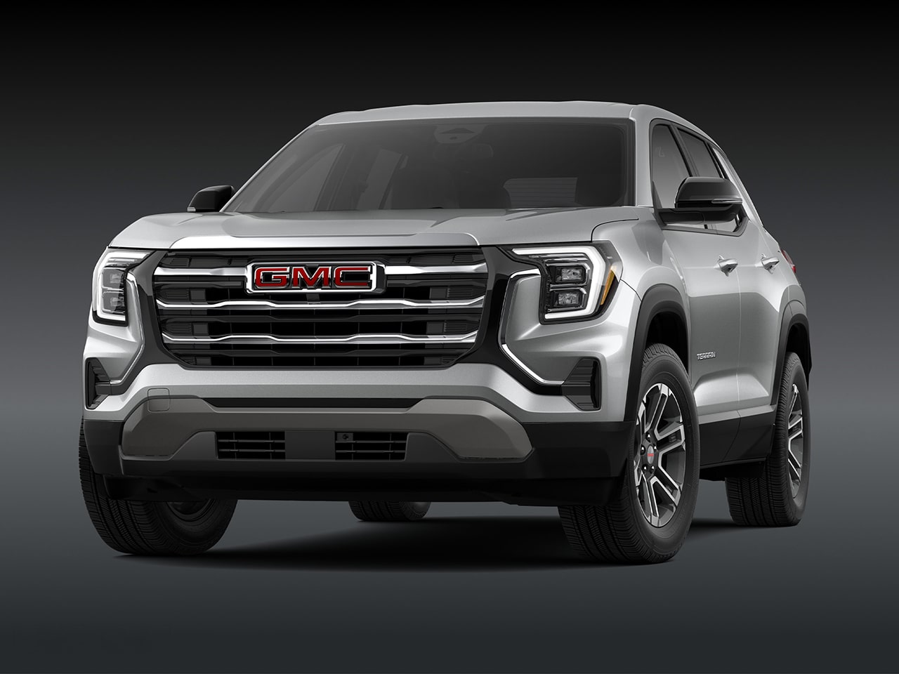 Vue de face d’un SUV GMC 2027 2027 en version argentée avec une calandre chromée.