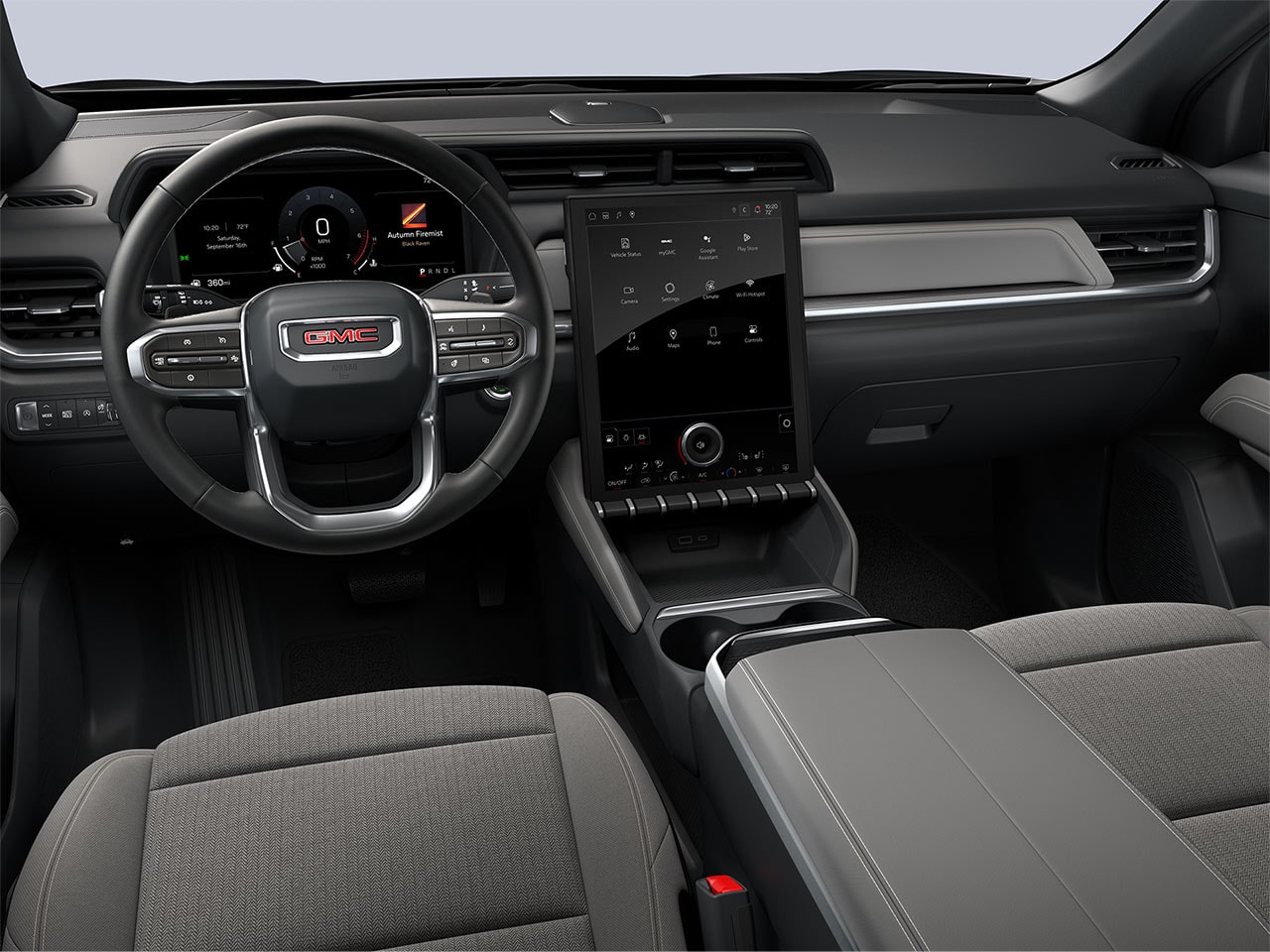 The Driver's Side Interior of a 2027 GMC Terrain Denali with Black Leather Seats, Steering Wheel, and Infotainment System.