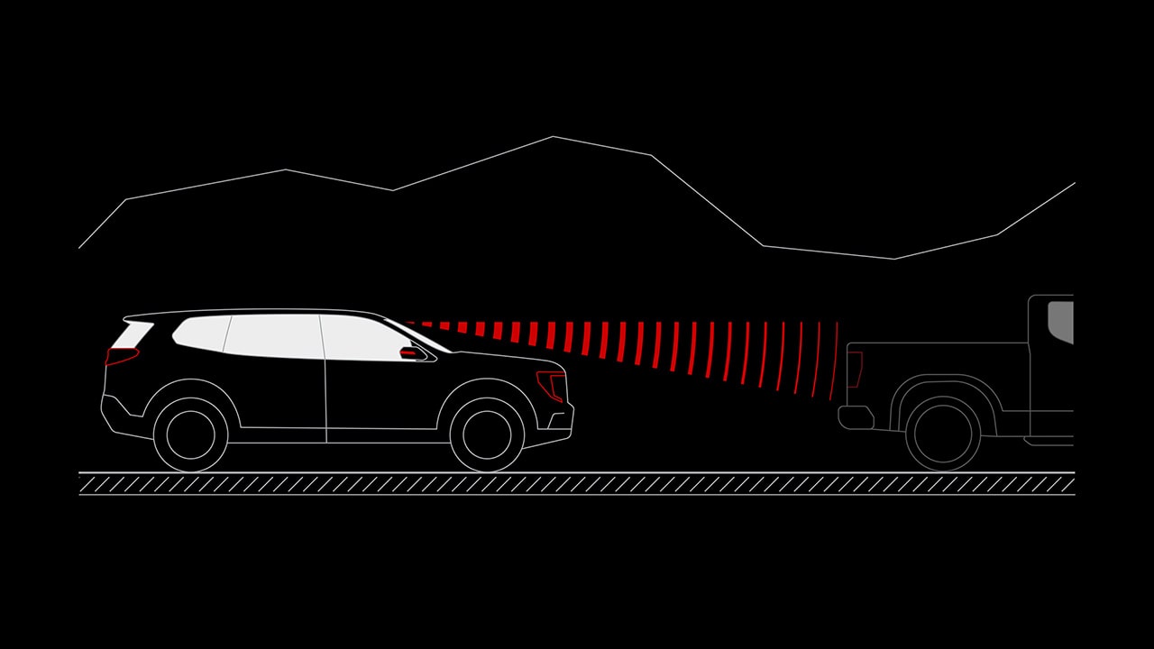 Un schéma d’un véhicule de terrain GMC noir 2027 avec des ondes radar rouges détectant un pick-up par derrière.