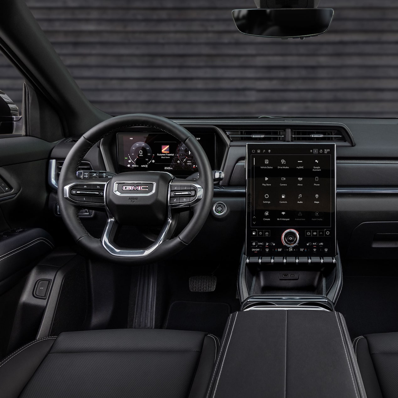 Le volant et l’écran du système d’infodivertissement du GMC Terrain vus par le conducteur.