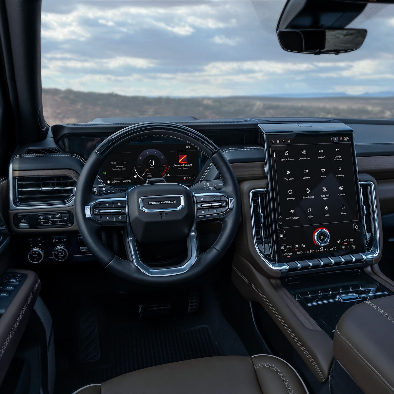Le volant et l’écran du système d’infodivertissement du grand VUS GMC Yukon.