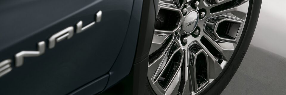 2022 GMC Denali insignia featuring luxury wheels.