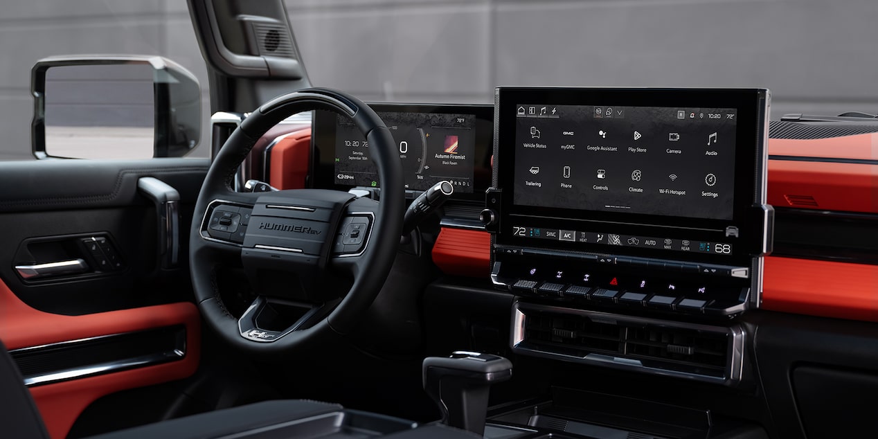 Close-up of the 2026 GMC Hummer EV Pickup Truck's Driver Seat 11" Driver Info Center and High-definition 13.4" Display Screen.