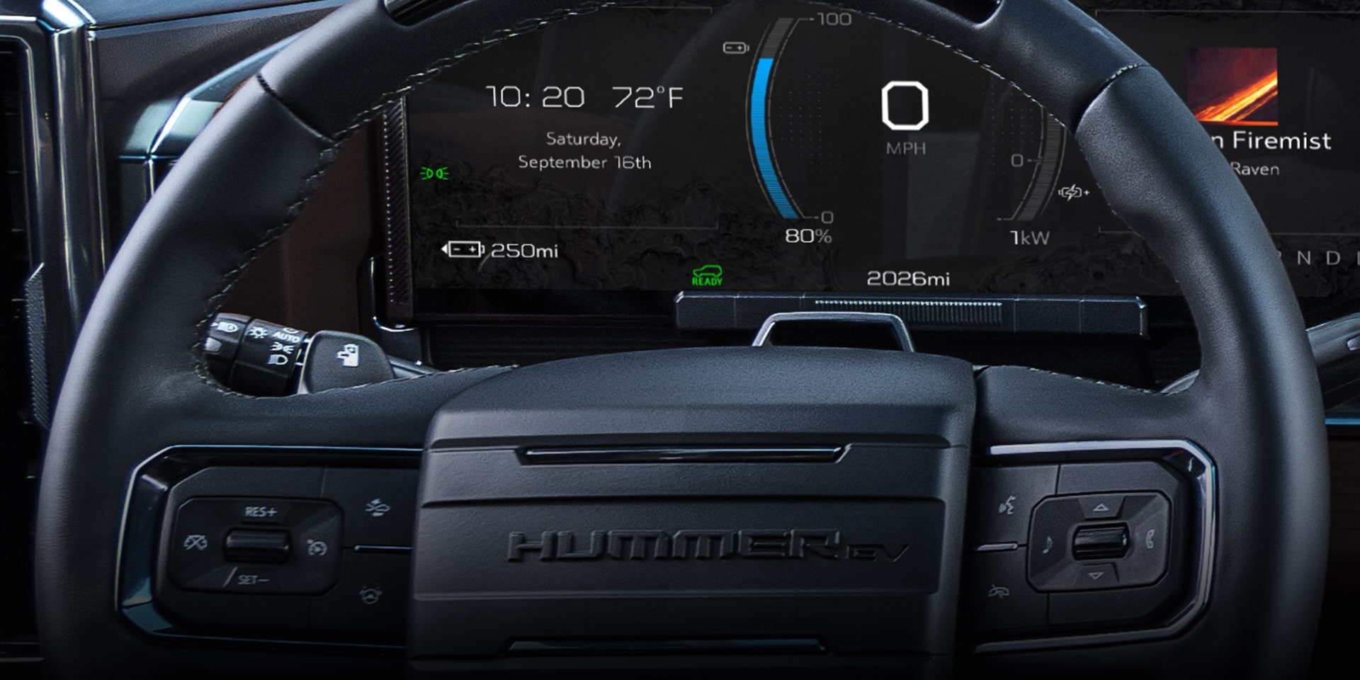 Close-up of the 2026 GMC Hummer EV Pickup Truck's Steering Wheel and Driver Information Center.