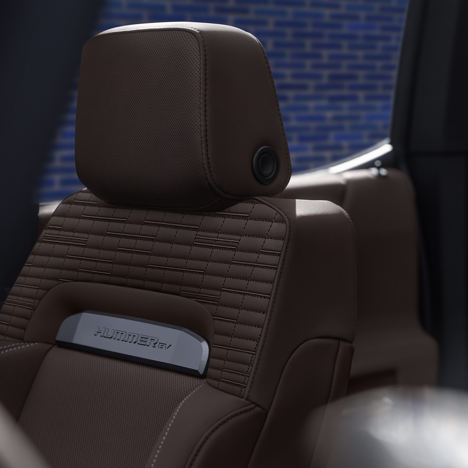 Vue rapprochée du nom du VUS GMC Hummer EV 2026 sur les sièges.