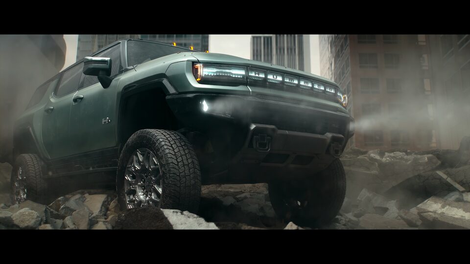 Side view of the GMC Hummer EV off-roading.