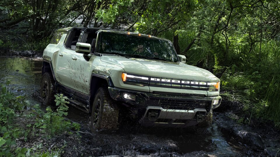 The Hummer EV showing off-road dominance.