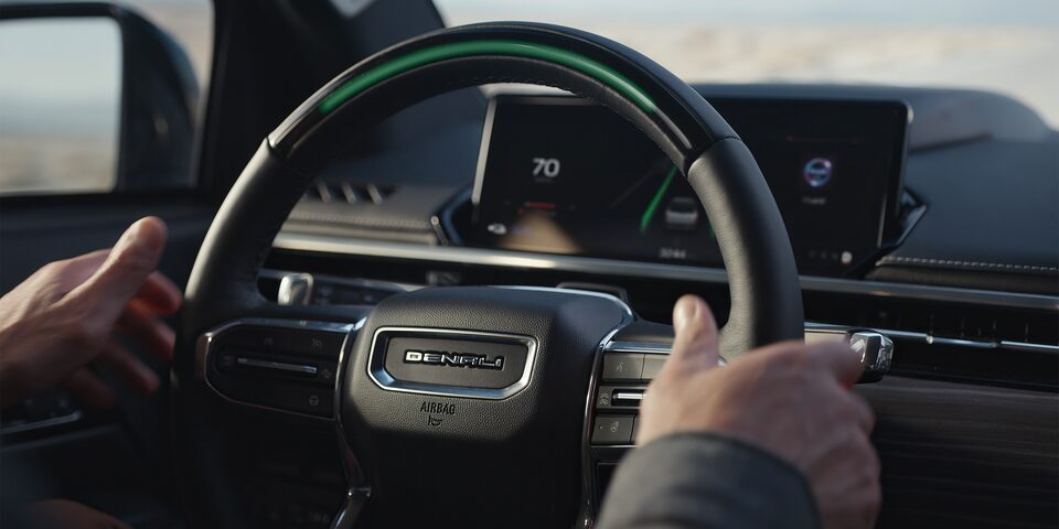 Close-up of the steering wheel of  the GMC Sierra EV Denali.