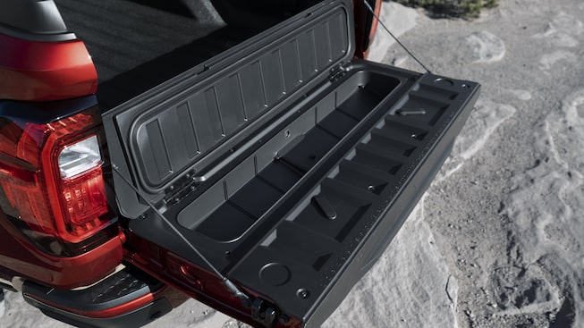 The 2023 GMC Canyon with tailgate open.