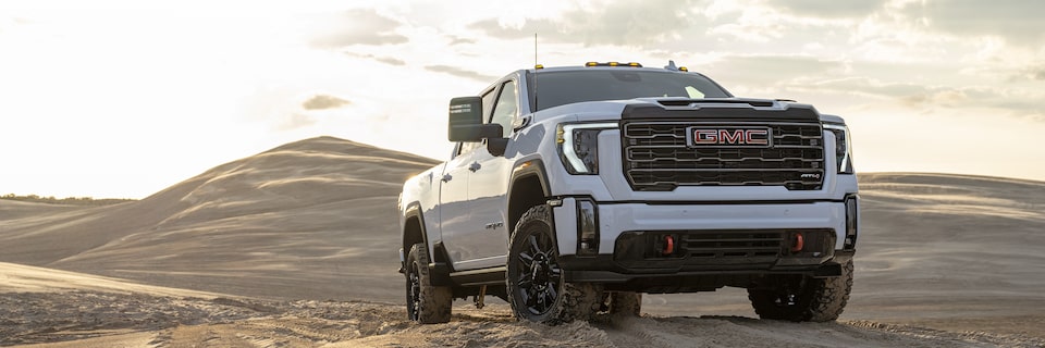 Front right profile view of the 2024 Sierra HD AT4: Premium Off-Roading.