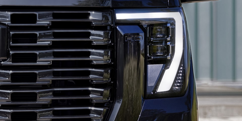 Close-up of LED projector headlamp of 2024 Sierra HD Denali Ultimate.