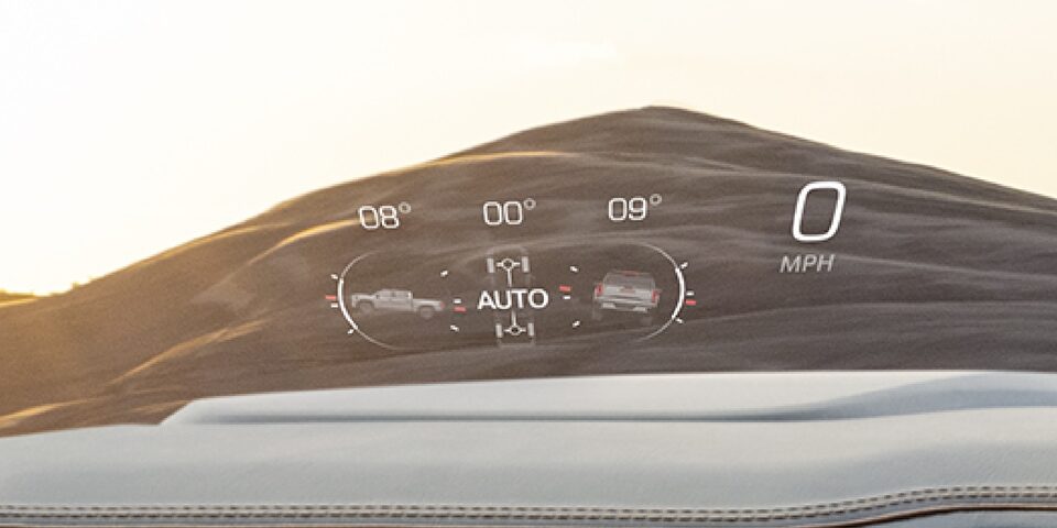 Reflected heads-up display of the 2024 GMC Sierra HD.
