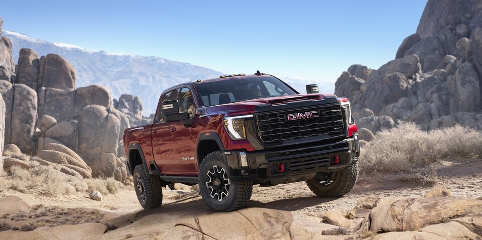 The 2024 GMC Sierra HD AT4X parked off-road.