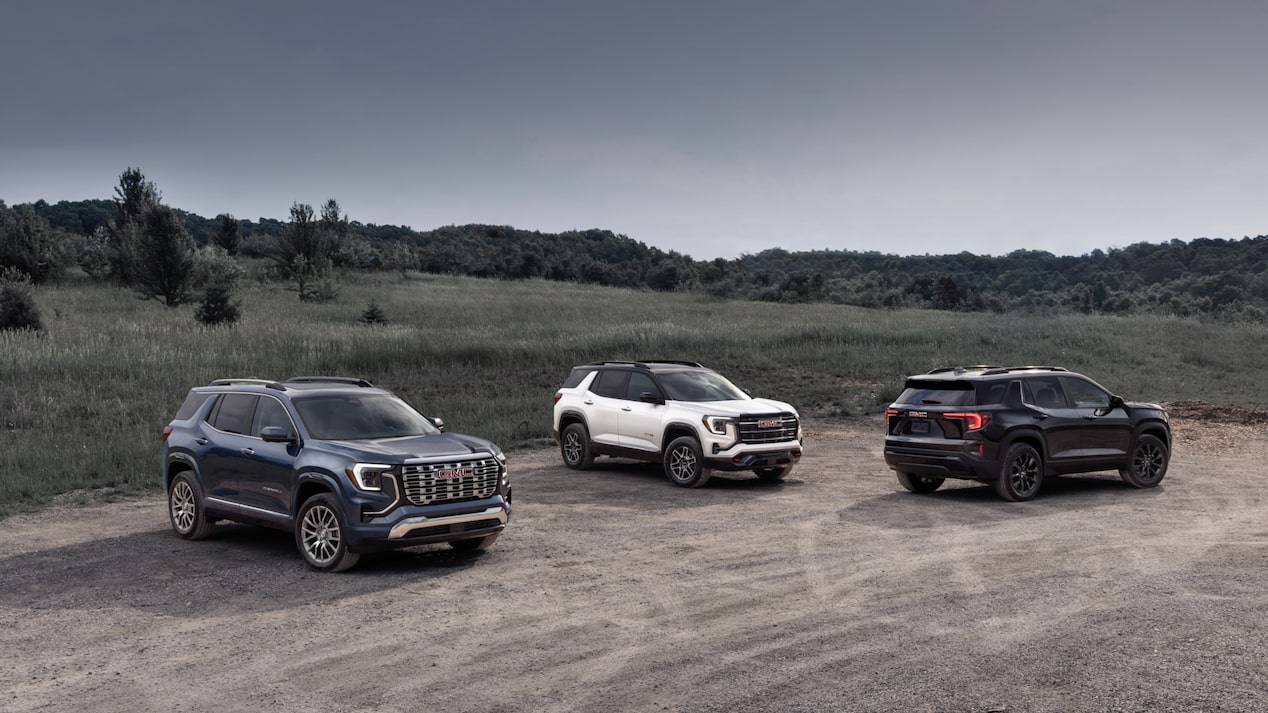 Three 2025 GMC Terrain vehicles parked near each other outdoors.