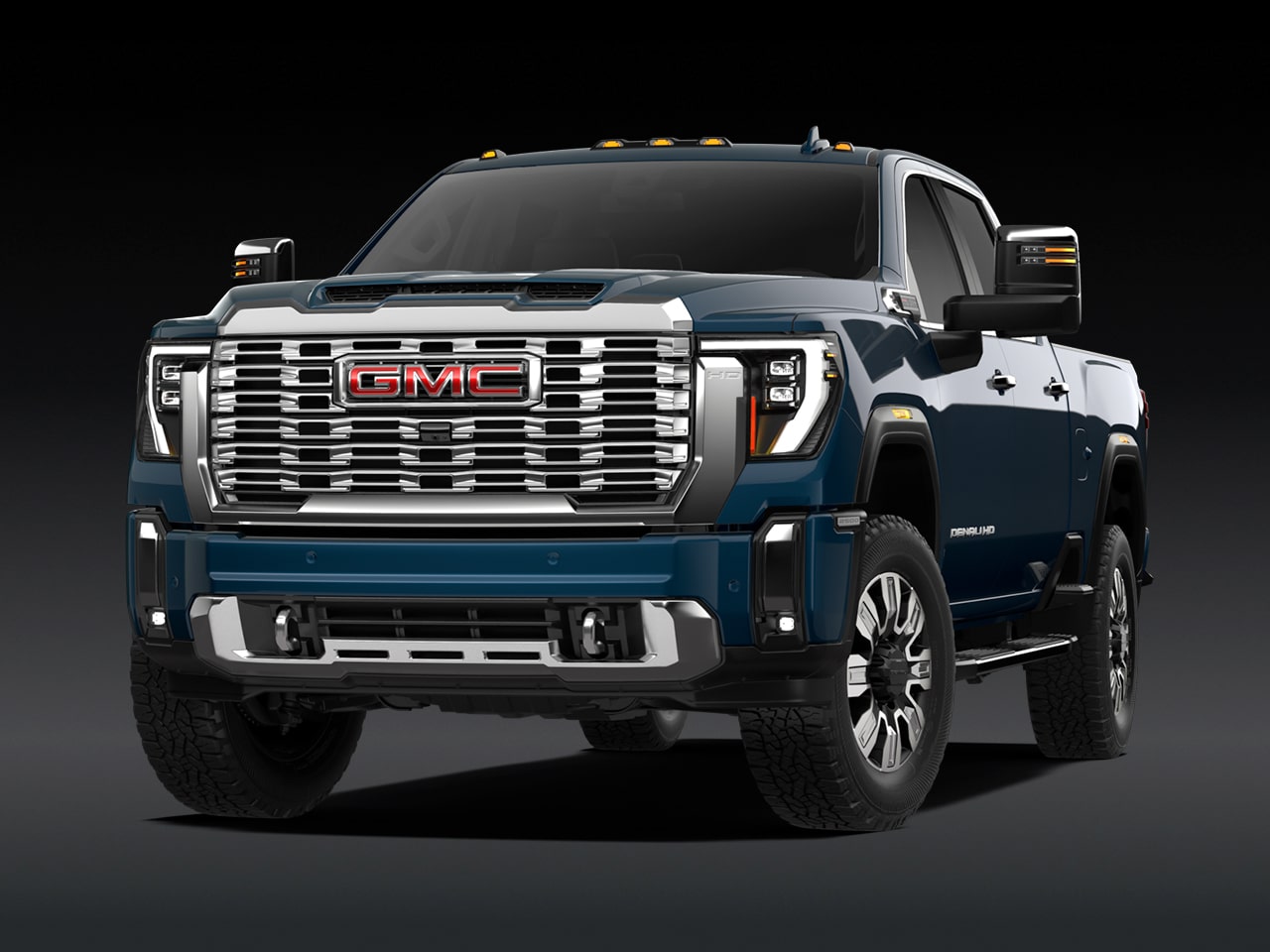 Vue avant d’un GMC Sierra HD Denali 2027 bleu.