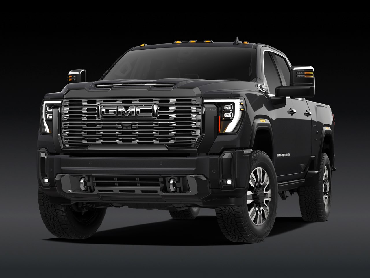 Vue avant d’un GMC Sierra HD Denali Ultimate 2027 gris foncé.