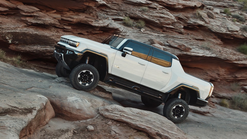 Side view of the GMC Hummer EV off-roading.