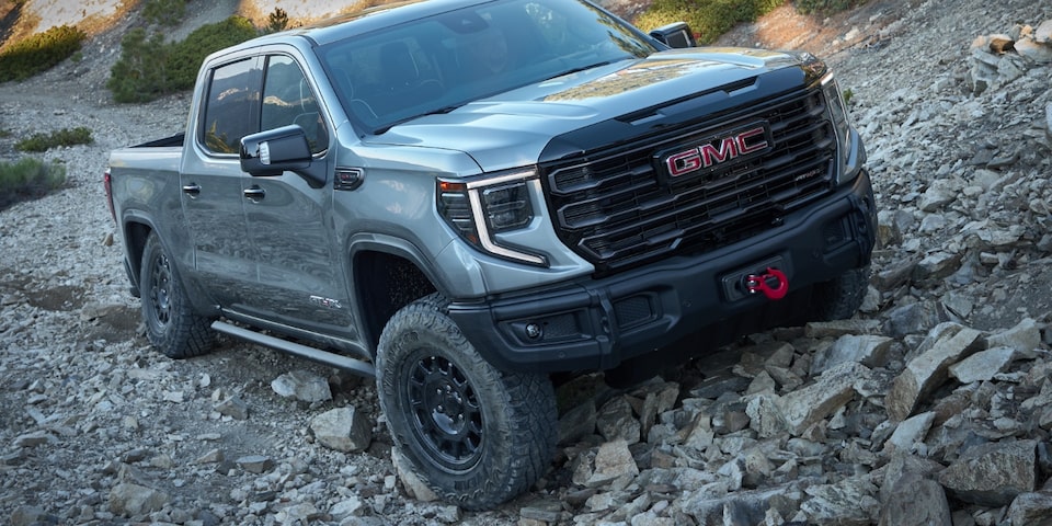 Front view of the GMC Sierra AT4X AEV Edition on stony terrain.
