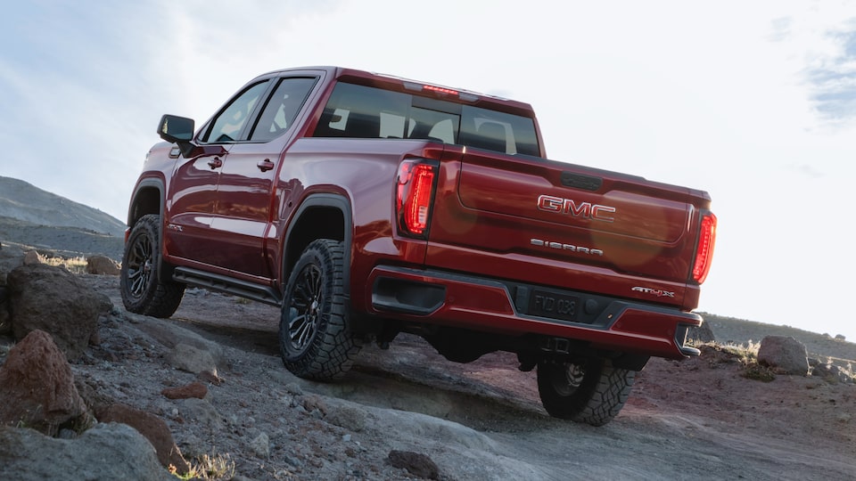 2022 GMC Sierra AT4X driving uphill.