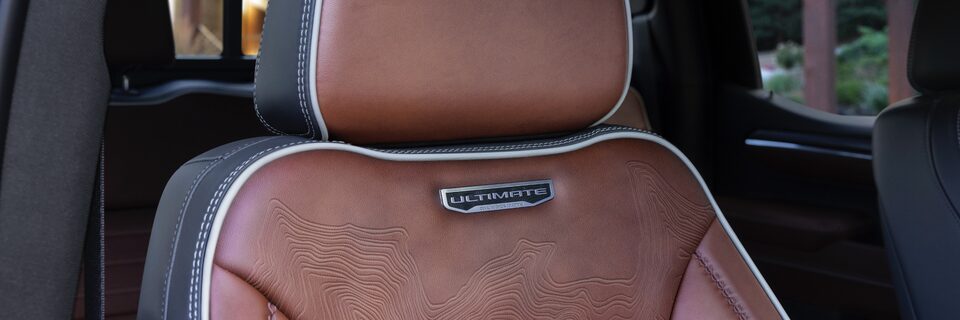 2022 GMC Sierra Refined Alpine Umber with full-grain leather seating and plaited contrast stitching.